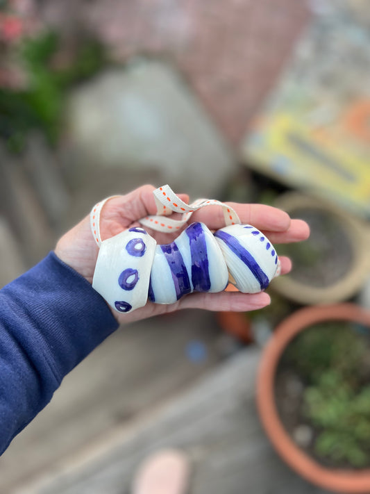 chunky thrown bead & cobalt jewelry on twill orange & cream cord samples/seconds/sale piece
