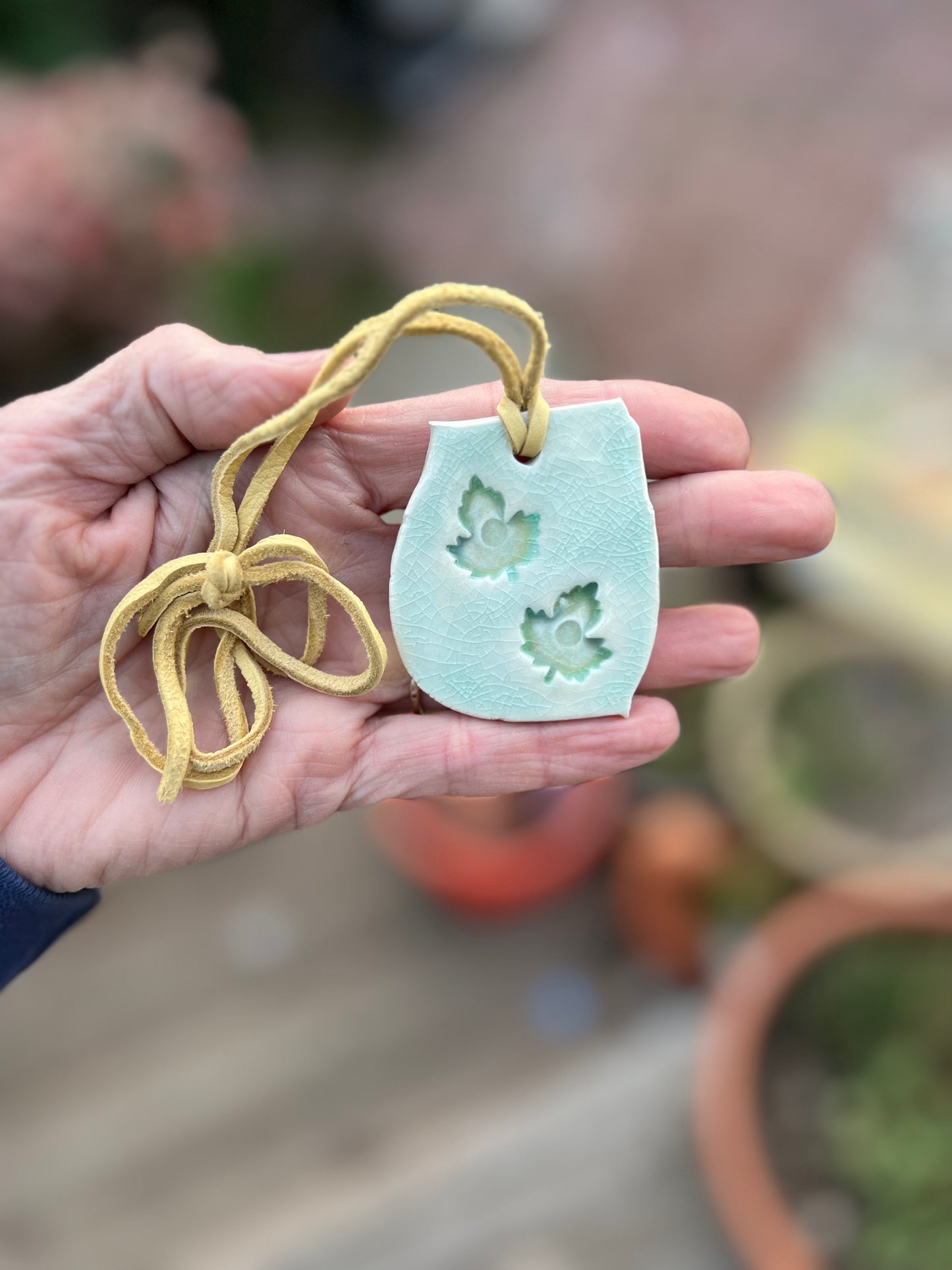 SOLD - celadon & green tea crackle glaze leaf jewelry on soft butter yellow leather samples/seconds/sale piece