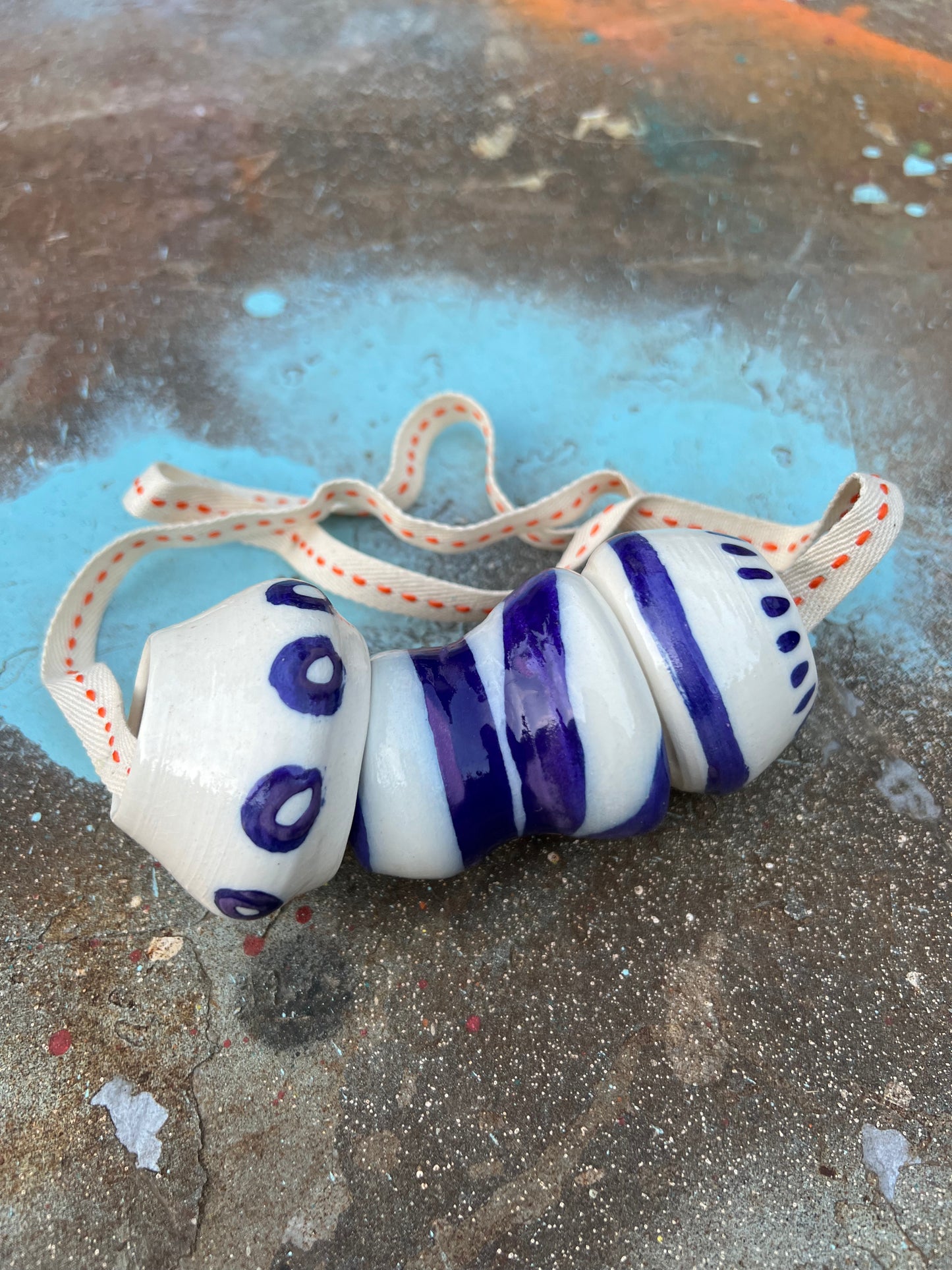 chunky thrown bead & cobalt jewelry on twill orange & cream cord samples/seconds/sale piece