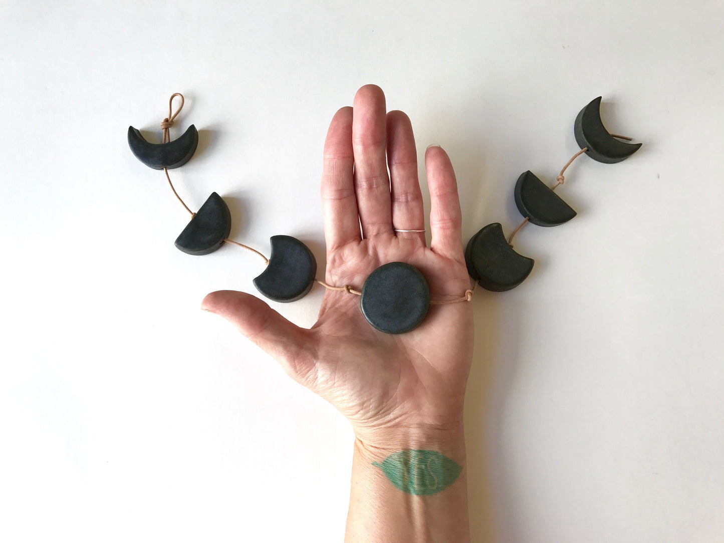 silvered sky & earth; matte white ceramic moon phases vertical wall hanging