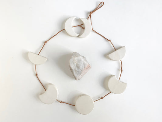 silvered sky & earth; matte white ceramic moon phases vertical wall hanging