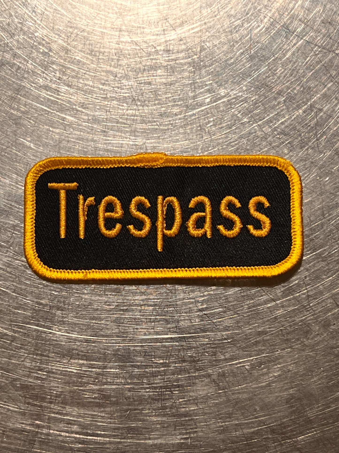 ‘Trespass’ embroidered patch