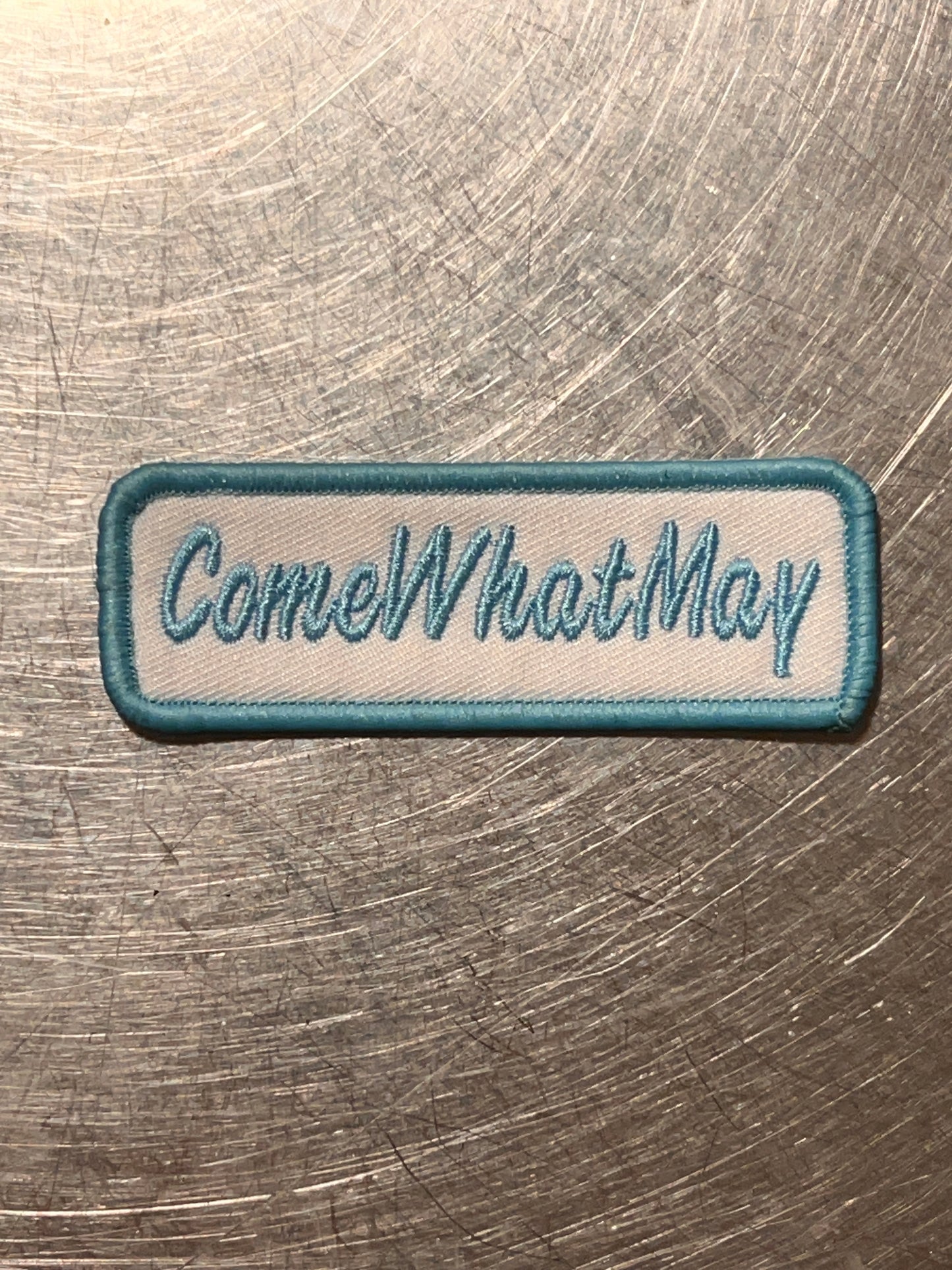 ‘ComeWhatMay’ embroidered patch