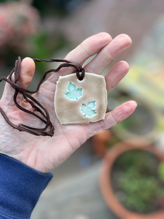 celadon & mocha cream crackle glazed leaf jewelry on soft brown leather samples/seconds/sale piece