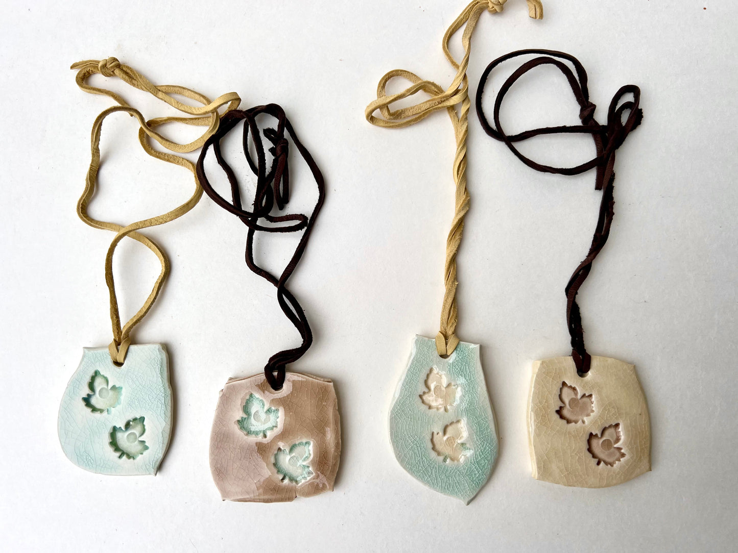 celadon & green tea crackle glaze leaf jewelry on soft butter yellow leather samples/seconds/sale piece