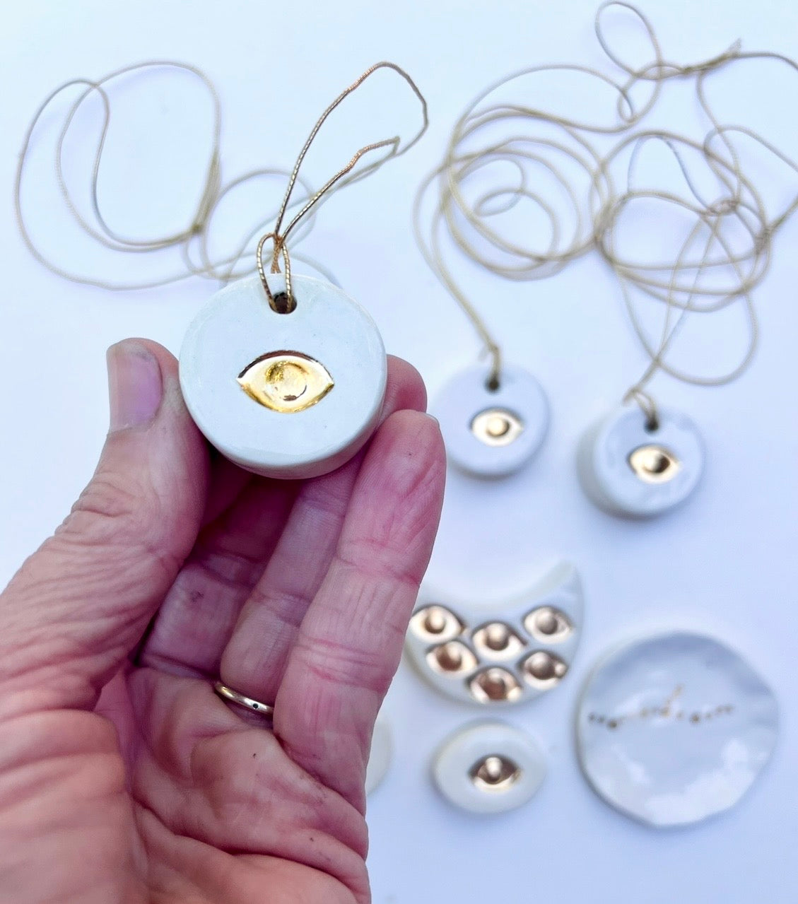 'talisman' gold lustre necklace &/or wall hanging piece