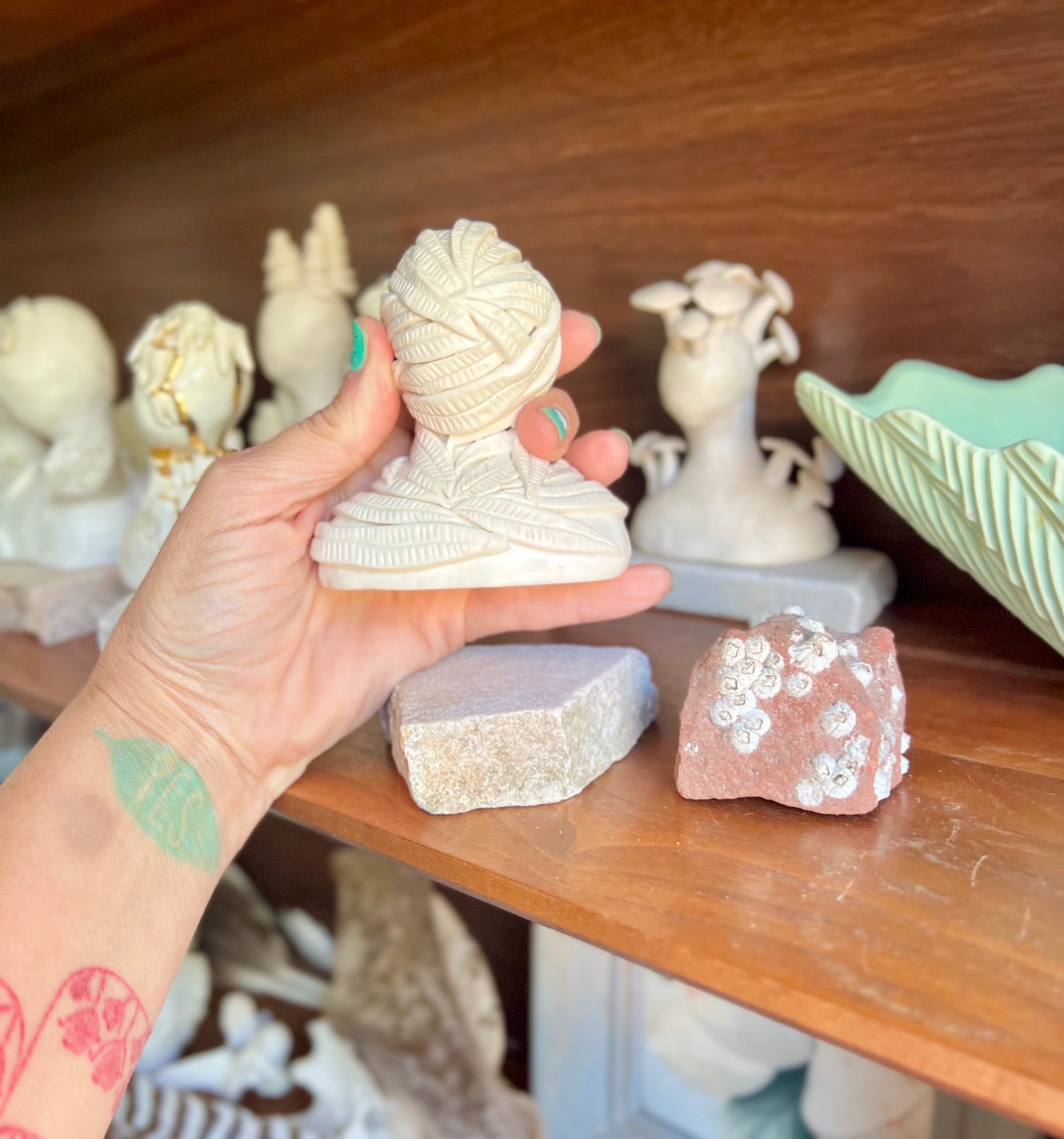 one of a kind eucalyptus lacey leaf ceramic statuette sculpture with natural base