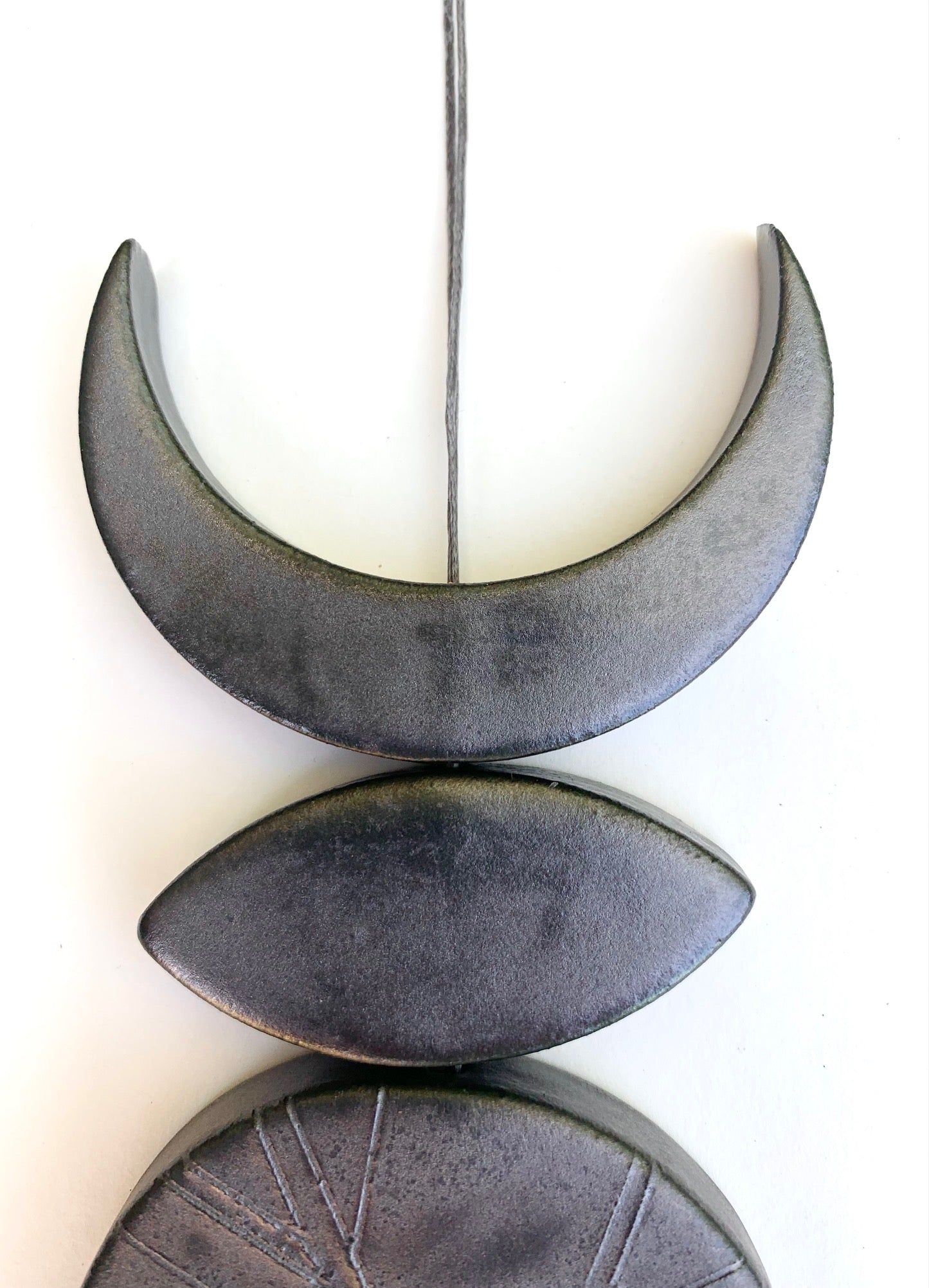 one of a kind 'circles of life' burnished steel moon wall hanging