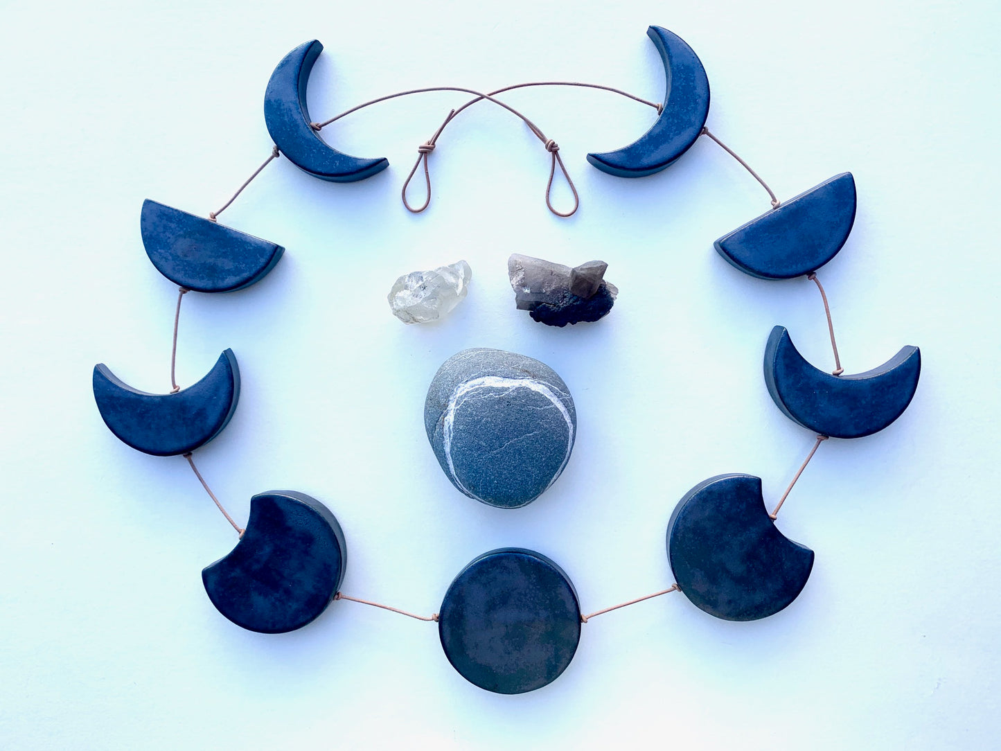 horizontal, ceramic 'black magic' moon wall hanging