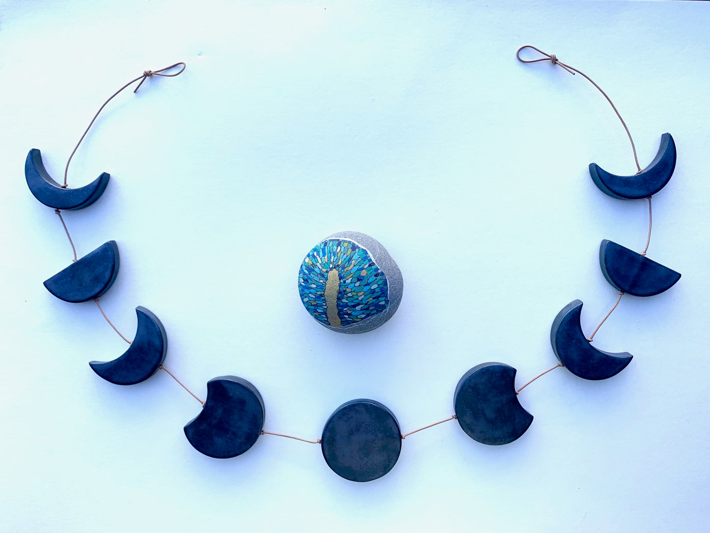 horizontal, ceramic 'black magic' moon wall hanging