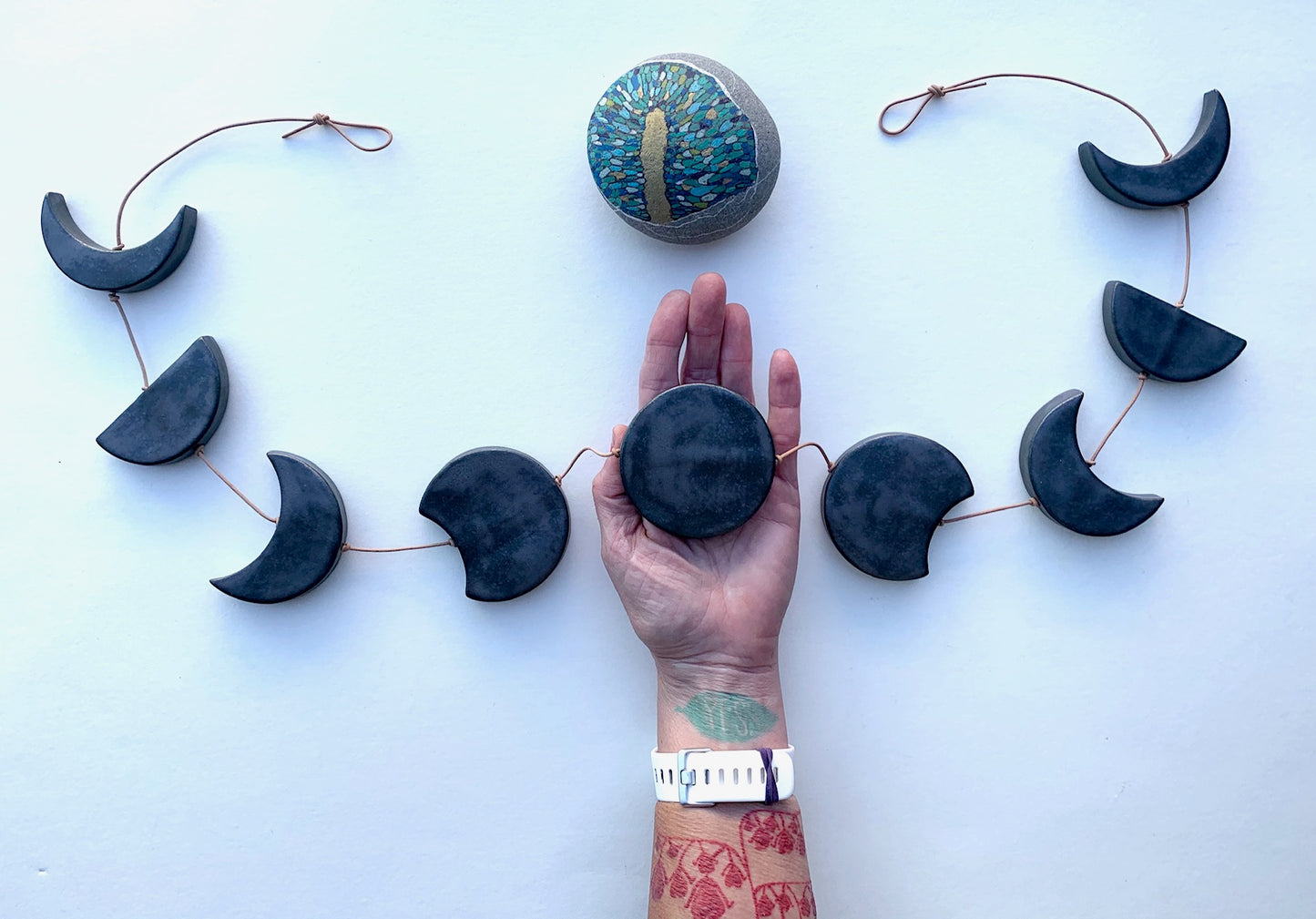 horizontal, ceramic 'black magic' moon wall hanging