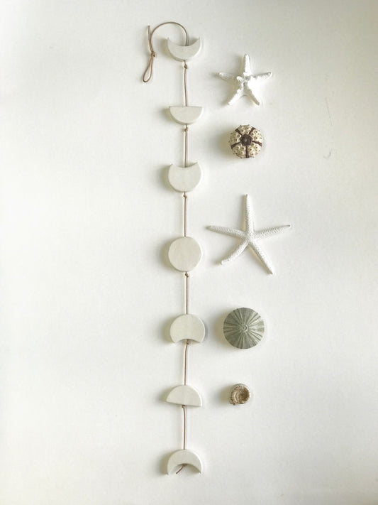 silvered sky & earth; matte white ceramic moon phases vertical wall hanging